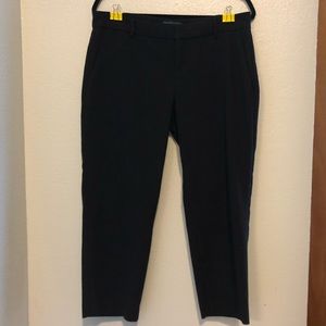 Mid-rise, straight leg, ankle length slacks